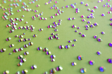 rhinestones on a green background,blure. design for text