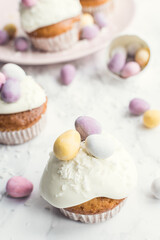 Glazed Easter cupcakes decorated with mini chocolate eggs