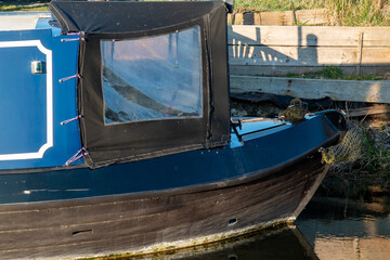 Fototapeta na wymiar Side view of front of blue narrow boat