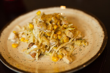 warm salad with chicken, cabbage and with corn and mustard sauce