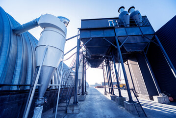 Naklejka premium Industrial metallic construction at background with clear sky