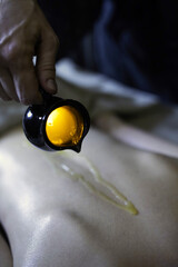Hot oil massage at beauty spa concept - 418688082