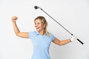Young Russian woman isolated on white background playing golf and celebrating a victory