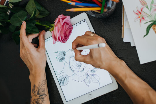 Tattoo art digital process on ipad. Tattoo artist working with Apple Pencil and drawing on iPad Pro in Procreate. Kropivnitskiy, Ukraine, September 27, 2019