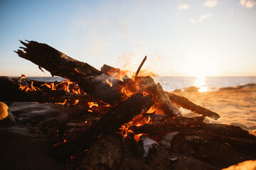 Beach bonfire in sunset