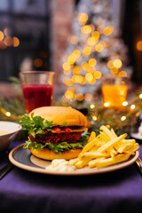 Fototapeta na wymiar Burger and fries on a festive table
