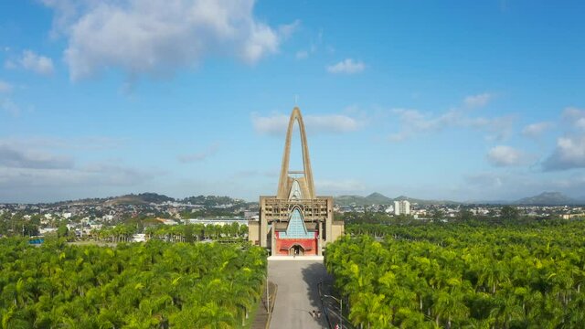 Catholic church and palm grove landscape stock video footage 4k.
