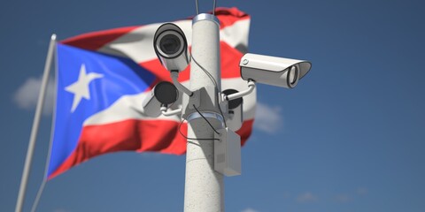 Naklejka na ściany i meble Waving flag of Puerto Rico and the security cameras on the pole. 3d rendering