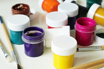 painting tools, mix of gouache paints and paintbrushes