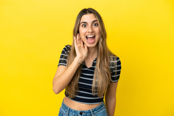 Young caucasian woman isolated on yellow background with surprise and shocked facial expression