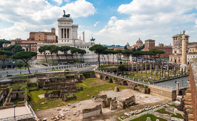 Naklejka premium View of roman forum ruins in front of historical palace built by Mussolini in Rome
