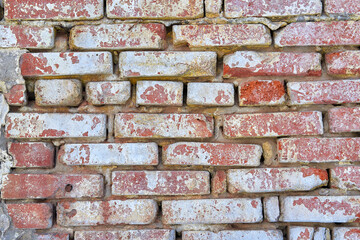 The texture of an old red brick wall. Close-up, pattern.