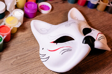 A fox mask design making by teenage girl. Drawing, creativity, hobby, diy, painting, development, education concept. Do it yourself step by step process.
