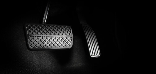 Accelerator and breaking pedal in a car. Close up the foot pressing foot pedal of a car to drive...