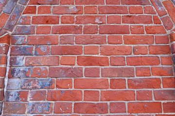 The texture of an old  red brick wall. Close-up, pattern.