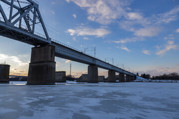 railway bridge winter. Railway bridge over the river. Steel structure, railway.