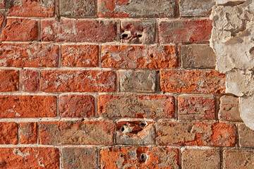 The texture of an old red  brick wall. Close-up, pattern.