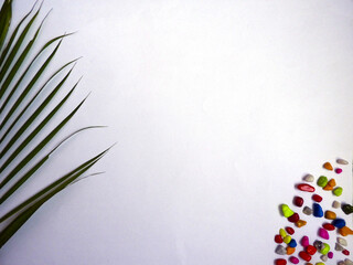 Leaf and multicolor stone concept. empty view and flat lay top view.