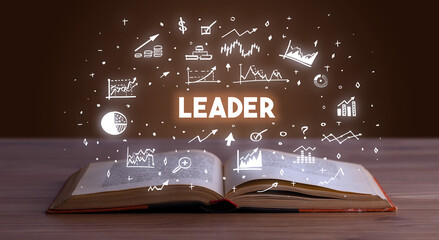 LEADER inscription coming out from an open book, business concept