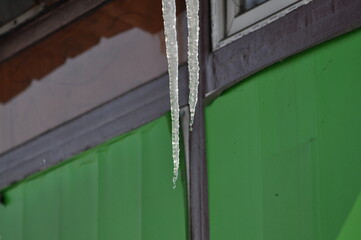 Icicles hang from the roof of the balcony
