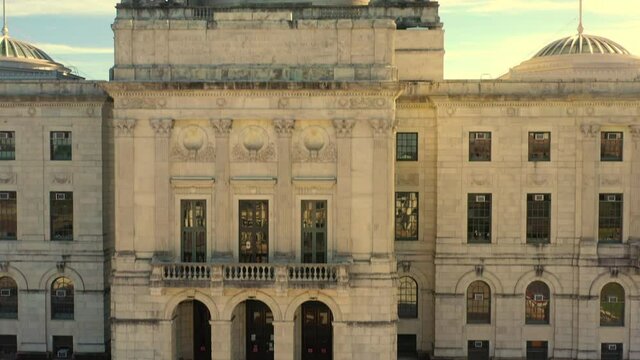 Aerial Shot Of State Government Office Building In City, Drone Ascending Near Dome Structure Against Sky On Sunny Day - Providence, Rhode Island