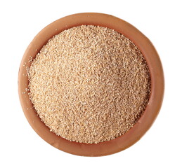 Spelt bran and grains in clay pot isolated on white background, top view