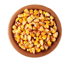 Yellow raw grain corn in clay pot isolated on white, top view