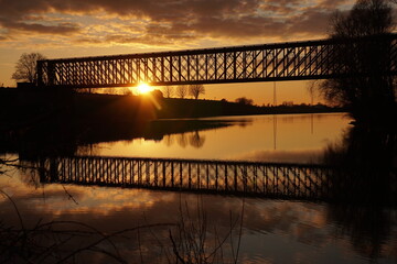 Sunset at an old rail bridge