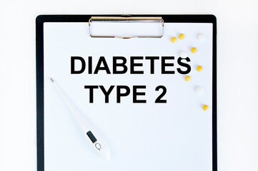 On the tablet, the text diabetes TYPE 2, next to the thermometer and yellow tablets.