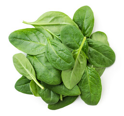 Pile of spinach leaves close-up on a white background. Top view.
