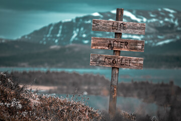 life after people text quote engraved on wooden signpost outdoors in landscape looking polluted and apocalyptic.