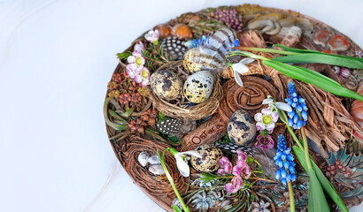 Wiccan Altar for spring Ostara sabbath. wheel of the year with flowers, feathers and eggs. Esoteric...