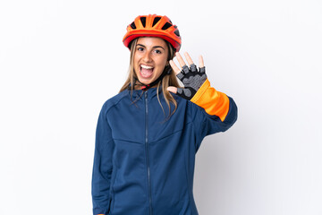 Young hispanic cyclist woman isolated on white background counting five with fingers