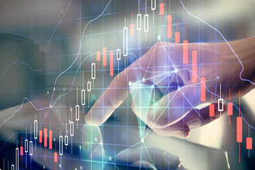 Multi exposure of man's hands holding and using a digital phone and forex graph drawing. Financial market concept.