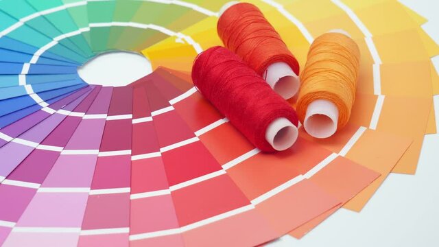 A palette of color maps for determining the color. Reference book of paint samples, color catalog. Selection of threads in the catalog for designers.