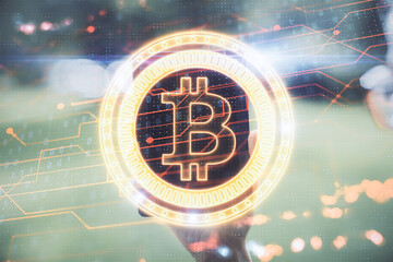 Double exposure of blockchain business sketch hologram and woman holding and using a mobile device.
