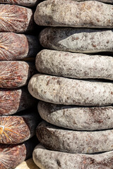 appetizing salami on sticks in the store counter