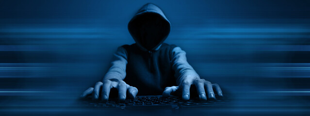 Cybersecurity, computer hacker with hoodie
