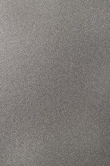 Fototapeta na wymiar Grey bumpy plastic metal surface with rough sparkle pattern macro