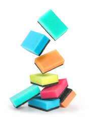 kitchen sponges falling on a pile on a white background