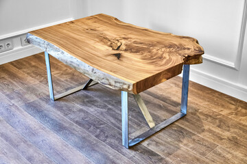 Modern live edge elm slab coffee table with inner knot in bizarre pattern shape and tree rings. Table top on metal support