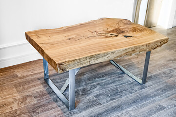 Modern live edge elm slab coffee table with inner knot in bizarre pattern shape and tree rings....