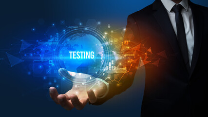 Fototapeta premium Elegant hand holding TESTING inscription, digital technology concept