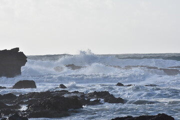 Fototapeta premium Watching the waves from the cliff