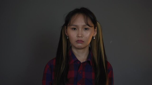 Portrait of Upset Attractive Asian Woman