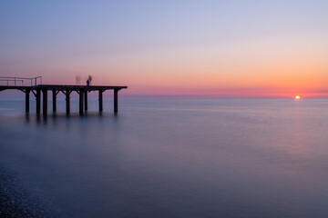 Fototapeta na wymiar Pier At The Sunset