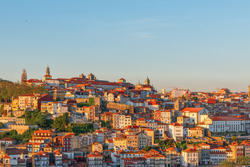 Fototapeta na wymiar Porto, Portugal old city skyline or downtown with colorful buildings and orange rooftops on sunset