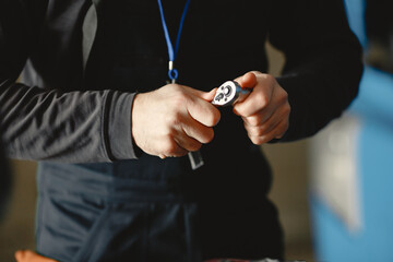Man in uniform. Truck repair. Car malfunction