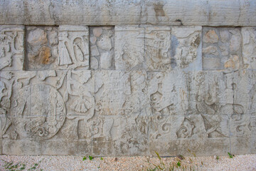 Stone carving at Juego de Pelota Ball Court at Chichen Itza archaeological site in Yucatan, Mexico. Chichen Itza is a UNESCO World Heritage Site.