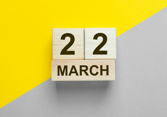 22 March inscription on yellow and gray background
